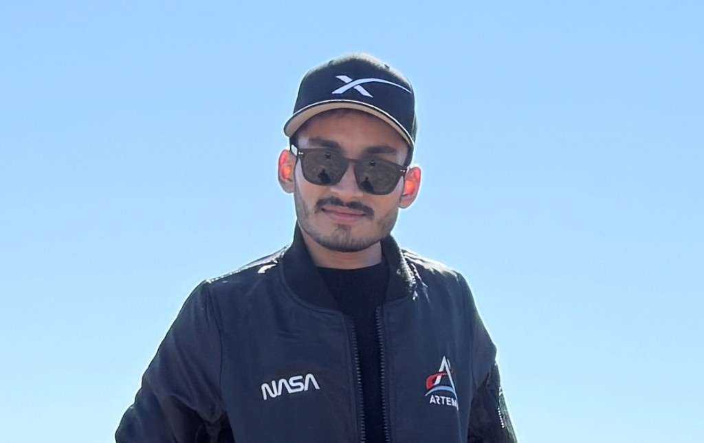 In SpaceX cap and NASA Artemis jacket